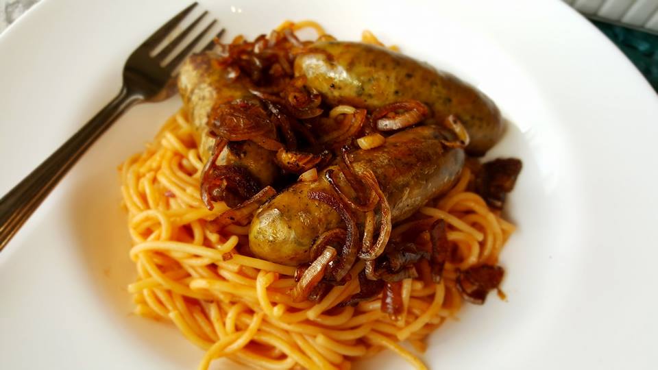 Balsamic glazed sausages with spaghetti in bowl