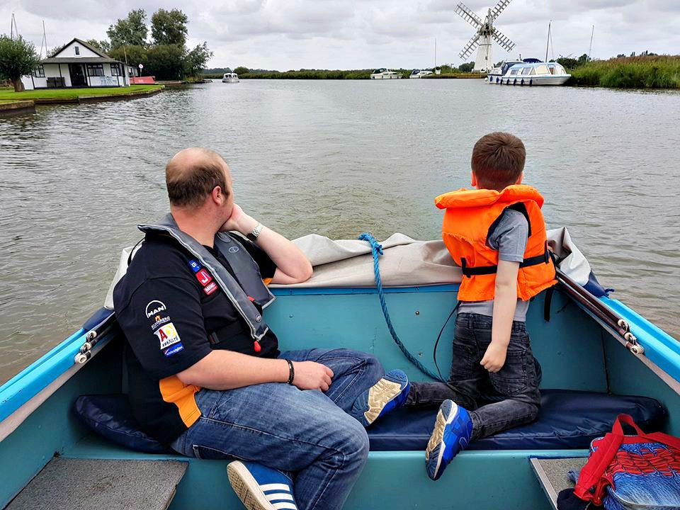 Herbert Woods day boat, sitting on a boat, Norfolk Broads, river