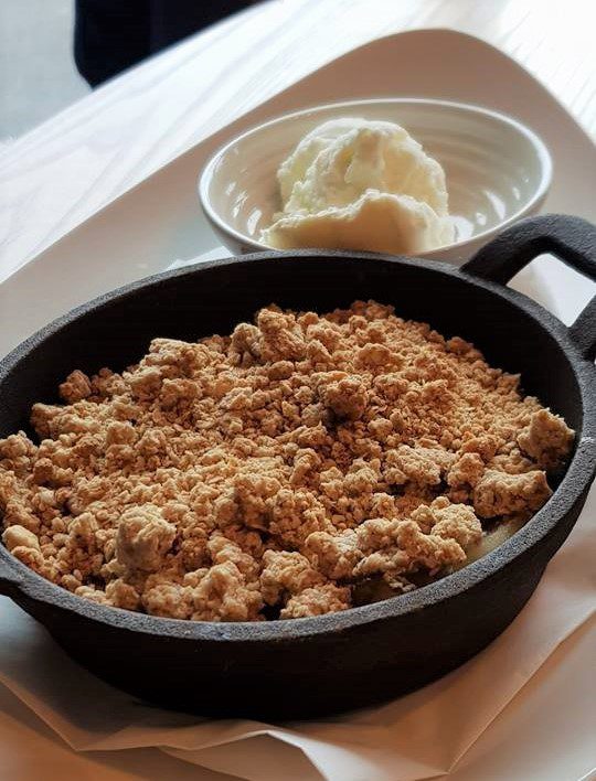 Apple crumble with ice cream dessert