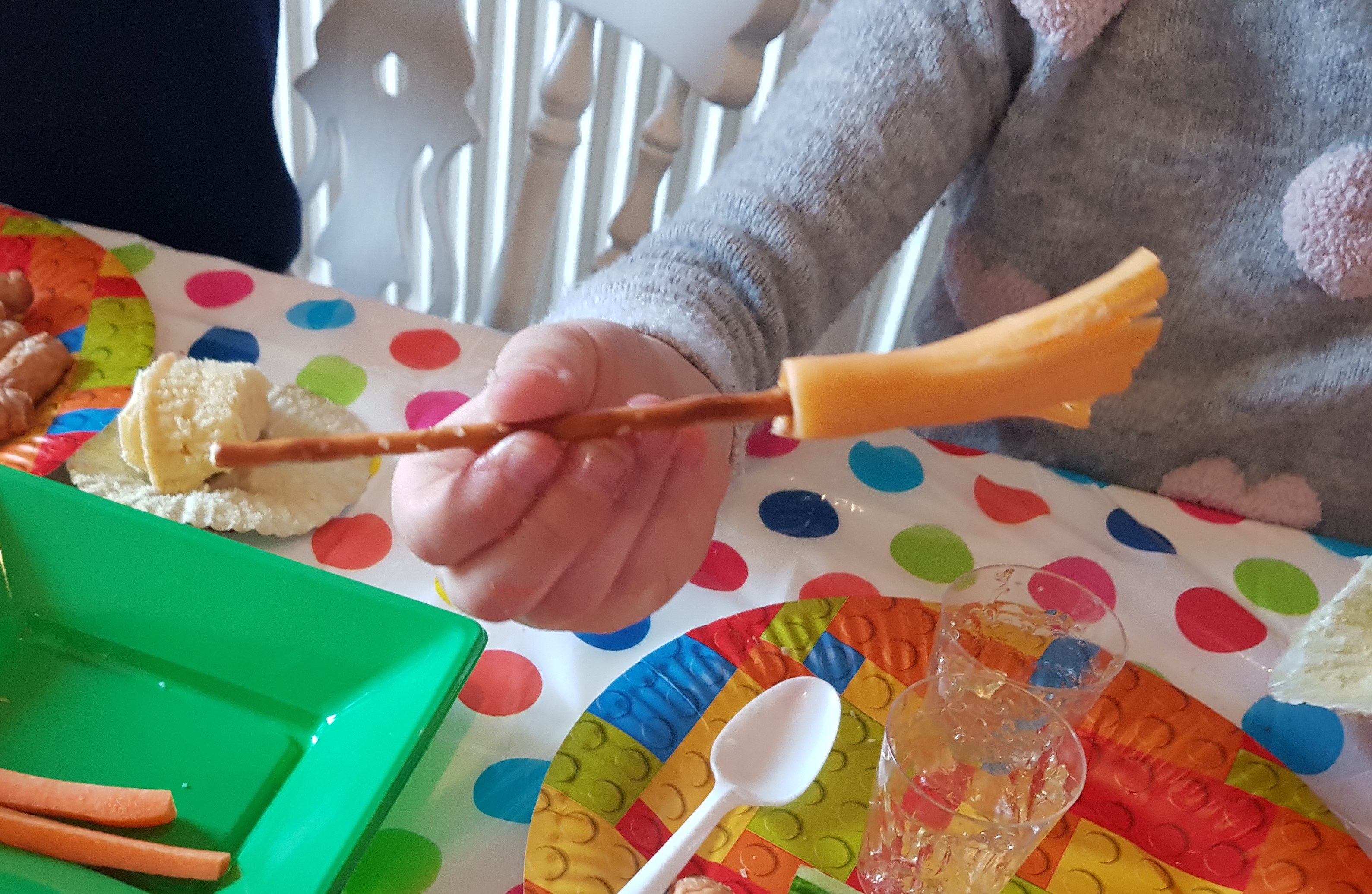 Broomsticks made of pretzel sticks and cheesestrings