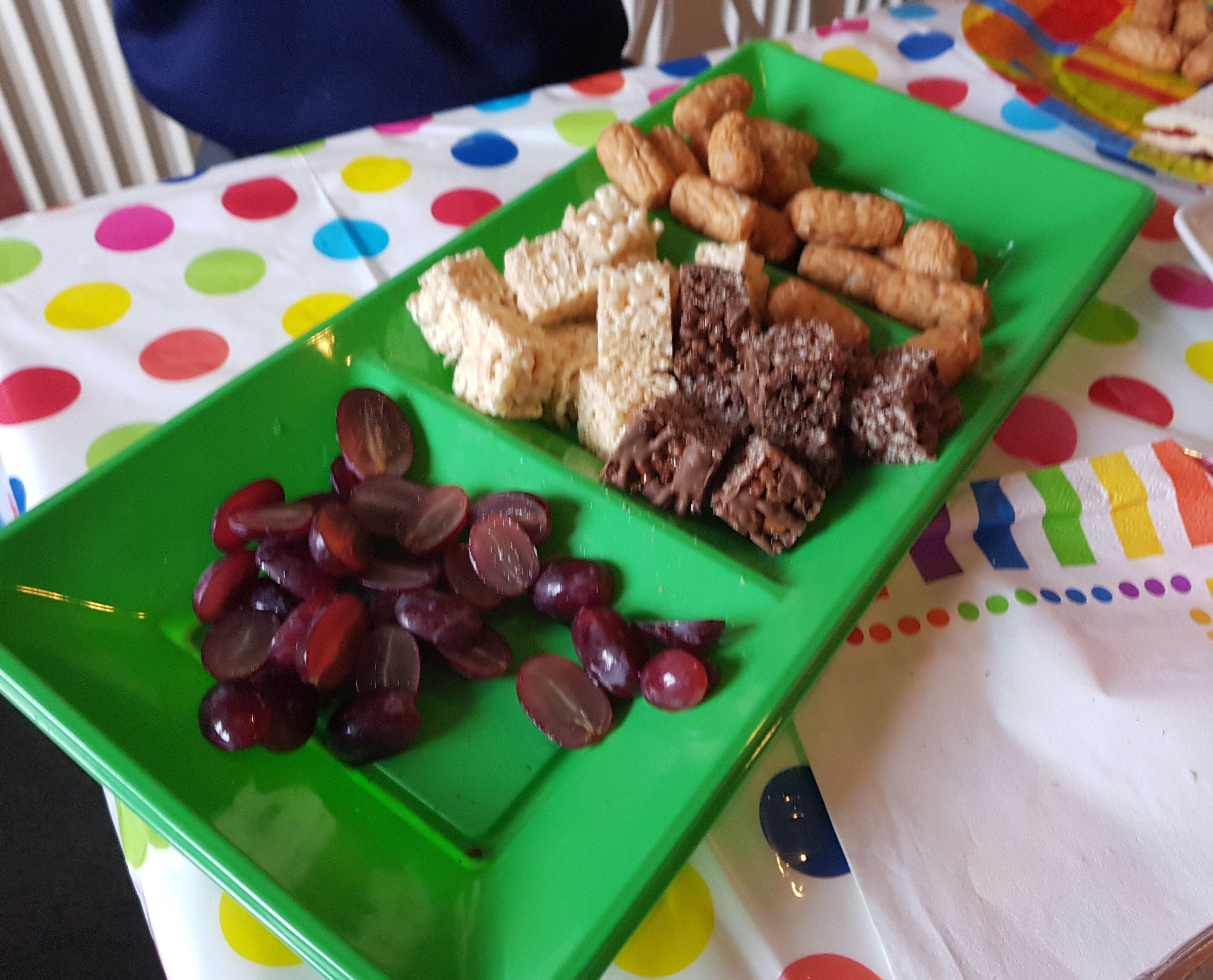 Grapes, rice krispie squares, cocktail sausages