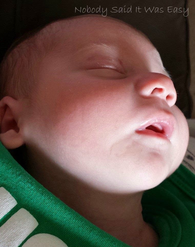 Close up of a baby drunk on milk