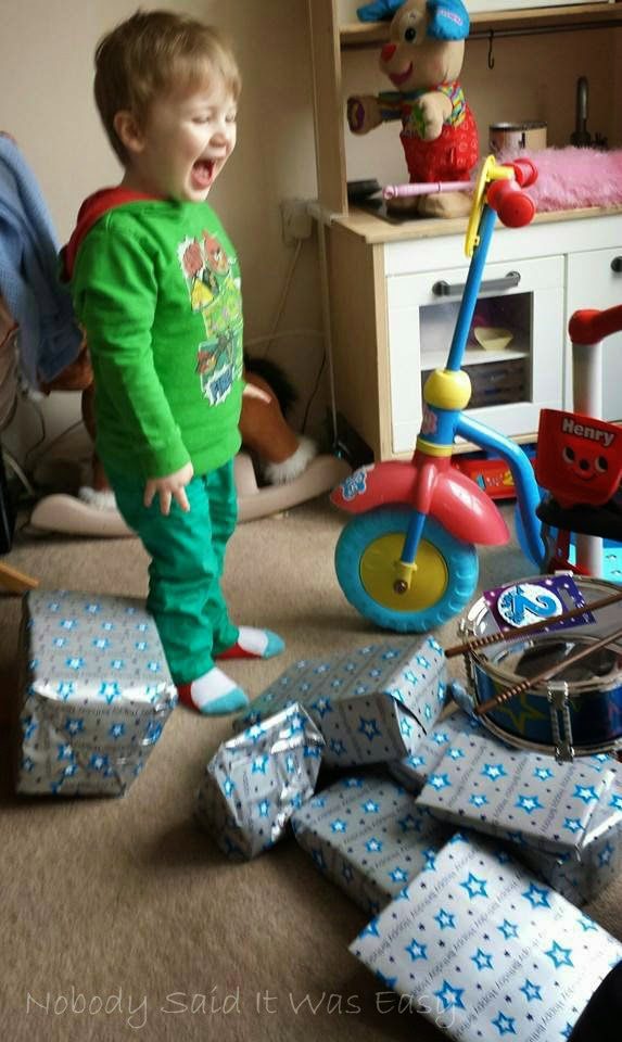 J looking excited discovering his 2nd birthday presents