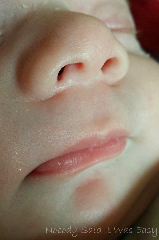 A close up of a baby's nose and mouth