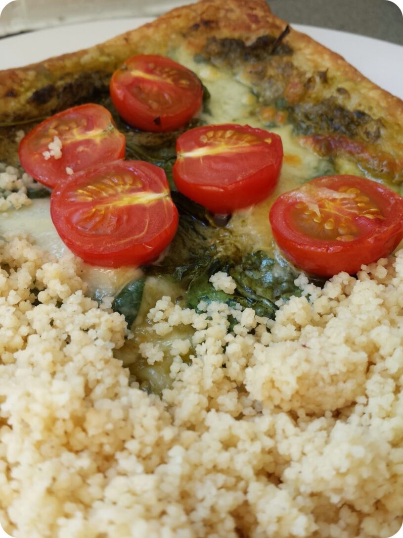 Pesto, spinach, tomato & mozzarella tart with cous cous