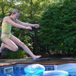 swimming pool, girl jumping in swimming pool