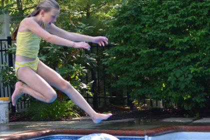 swimming pool, girl jumping in swimming pool
