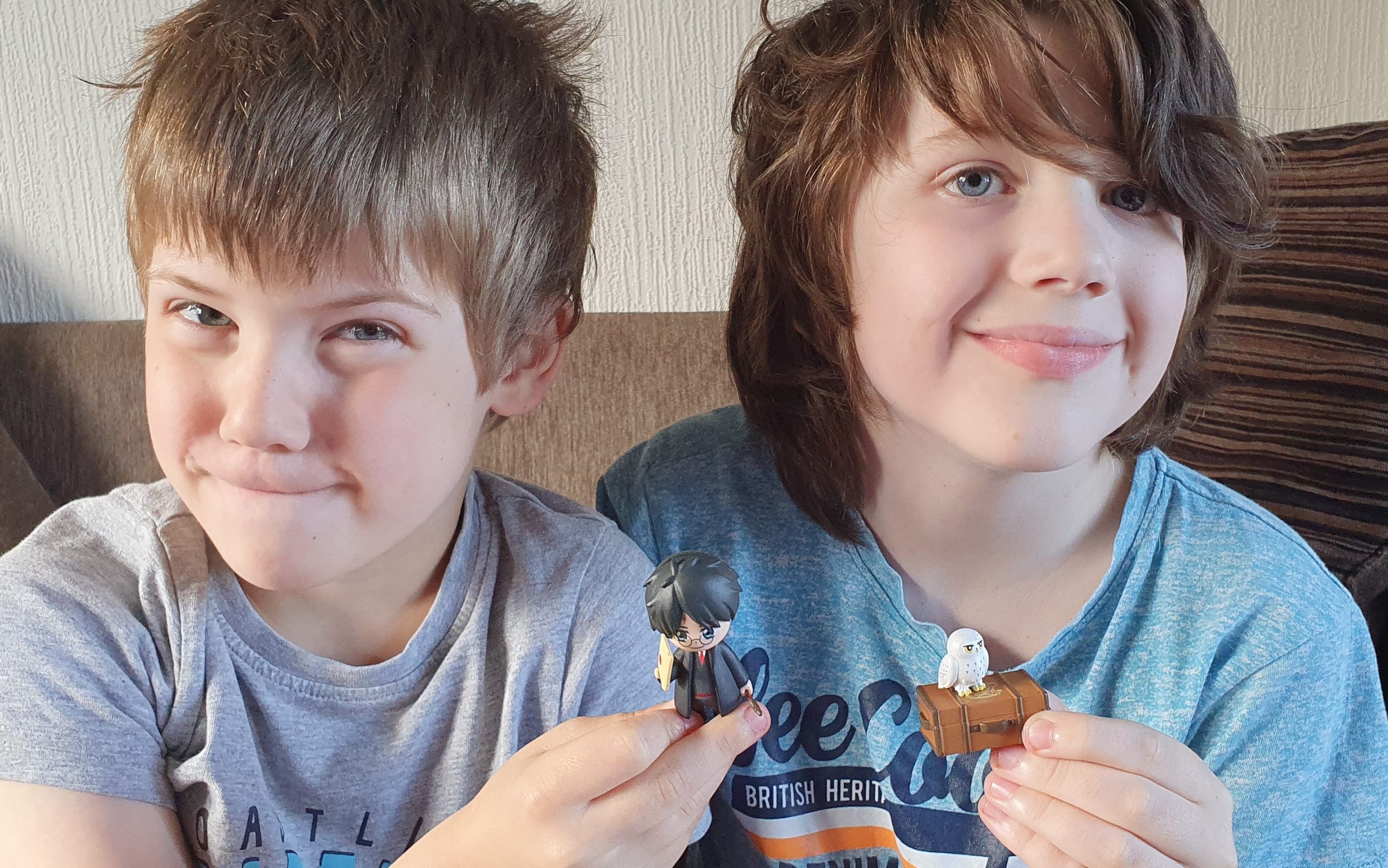 Boys holding Magical Capsule contents