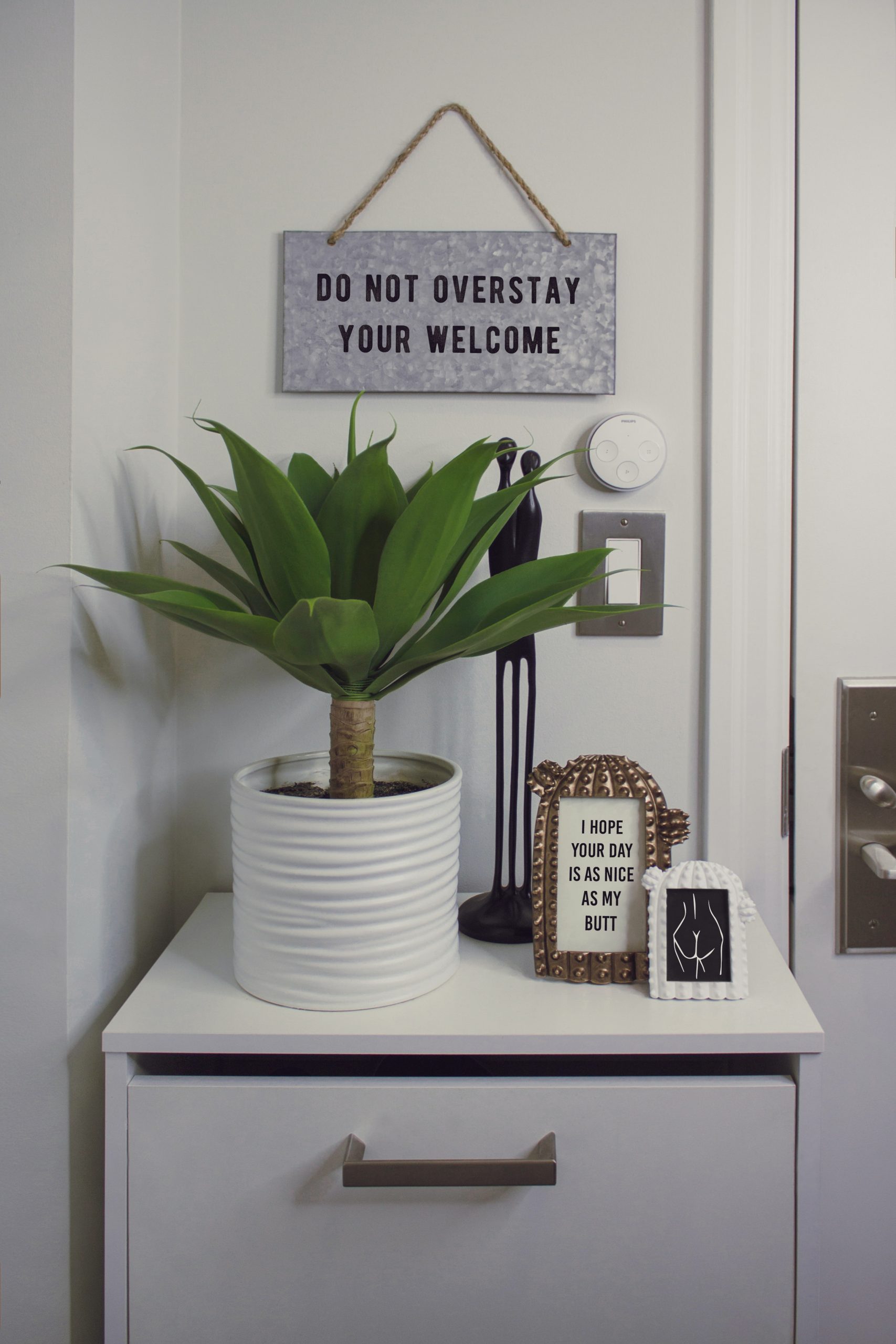 indoor plant surrounded by quote pictures; Easy Ways to Update Your Home Decor