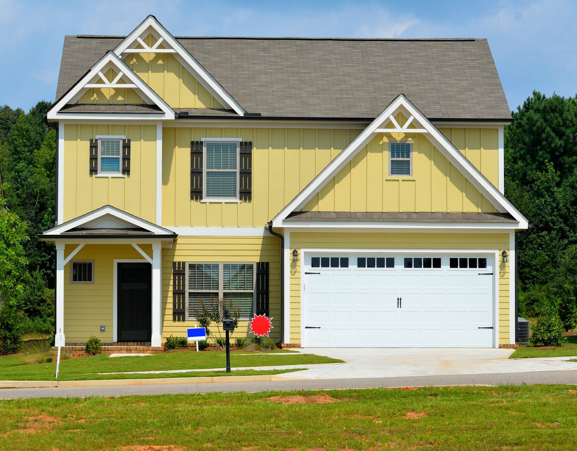 yellow house with sale signs; Short Guide To Make Your House Move Easy