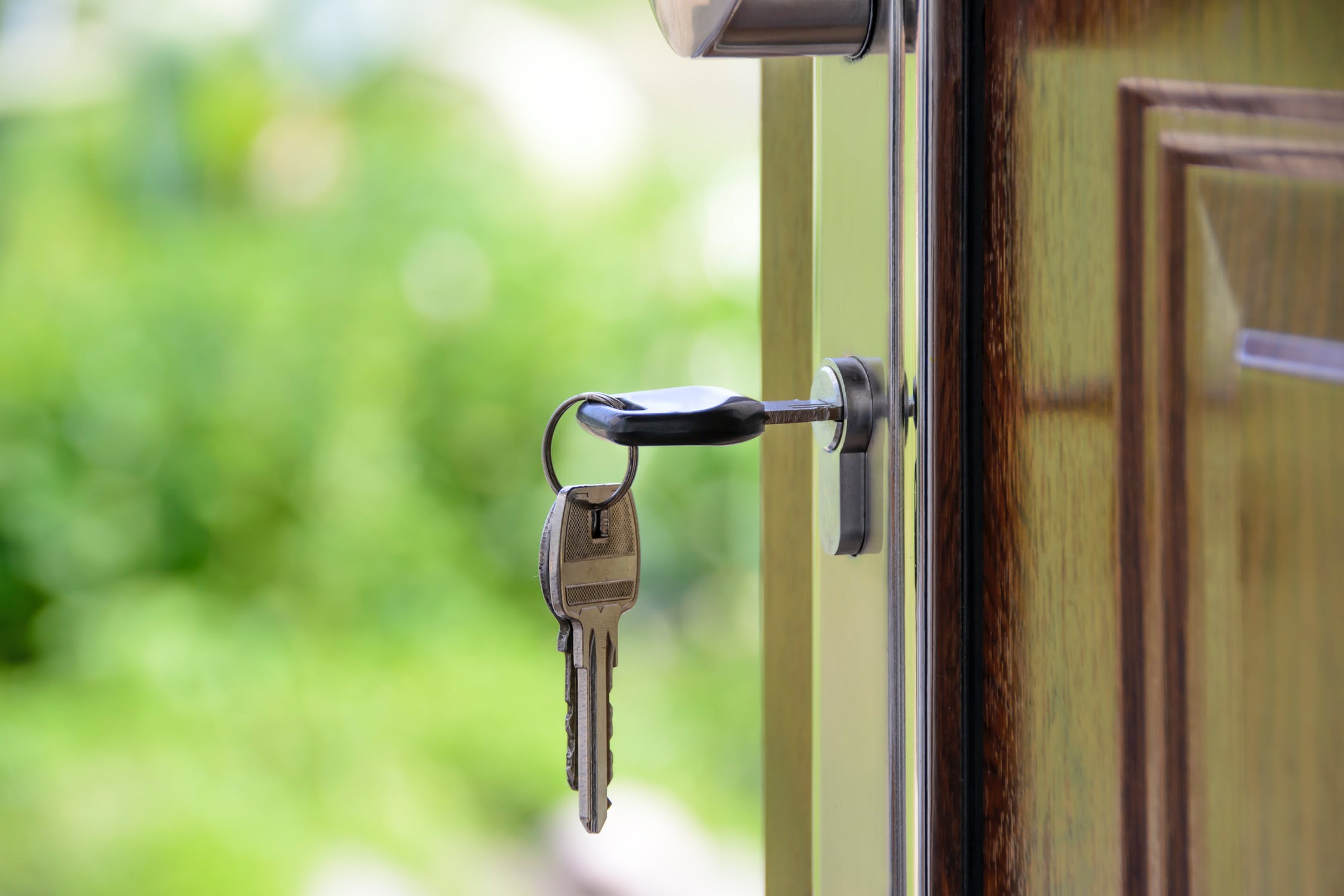 a key in a door lock; Are You Thinking About Buying A New Home