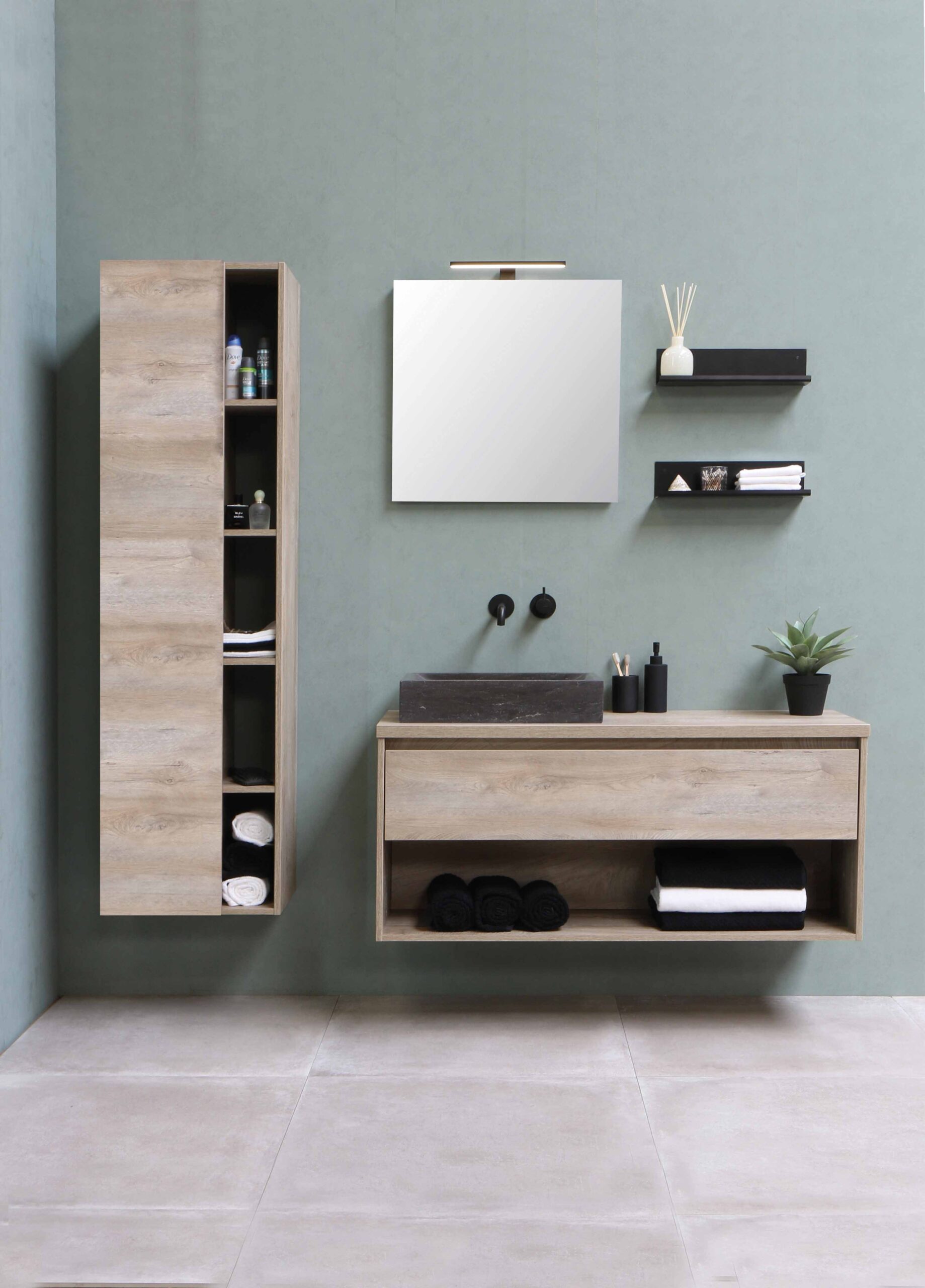 a grey bathroom wall with a variety of light wood shelves around a square mirror