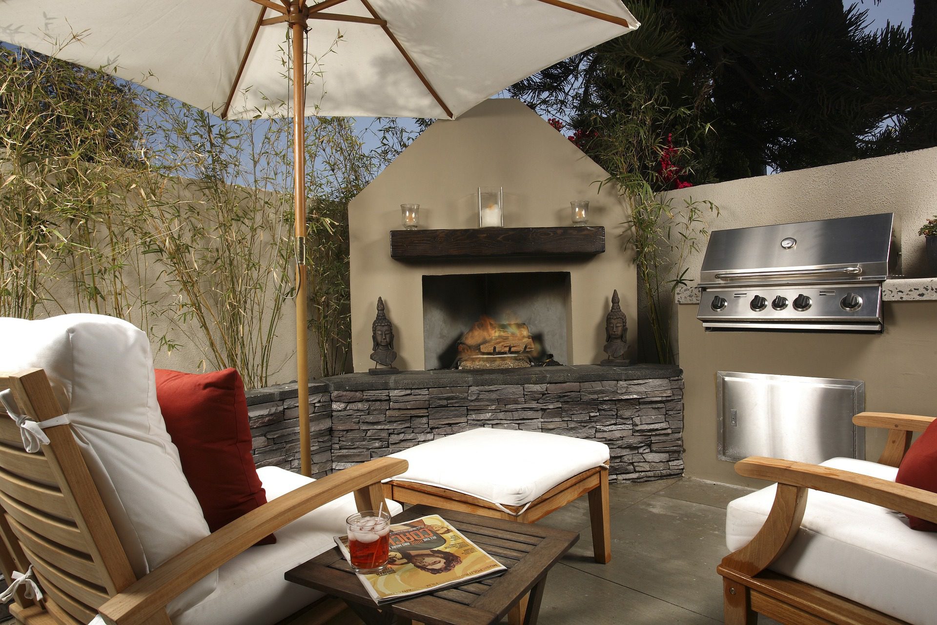 Outdoor seating area with an outdoor oven and a wood burner
