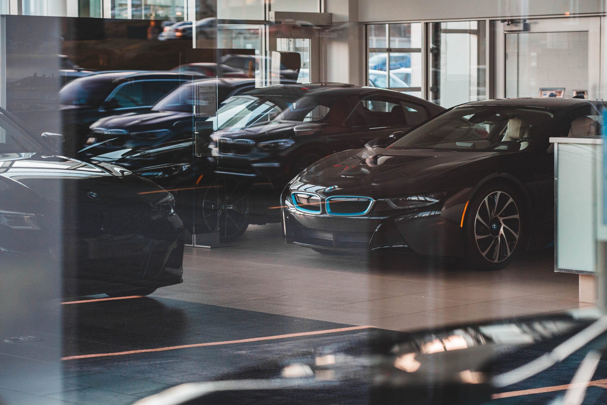 a row of black cars on a garage forecourt; The Car Buying Tips You Need To Know