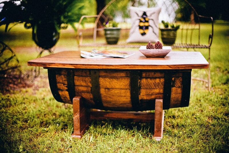 a rustic handmade table made from a beer barrel
