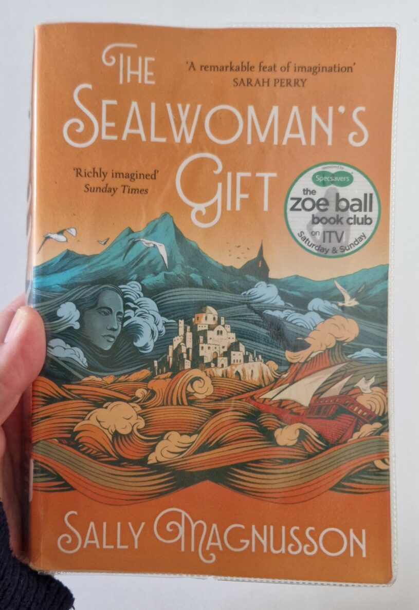 A paperback copy of The Sealwoman's Gift