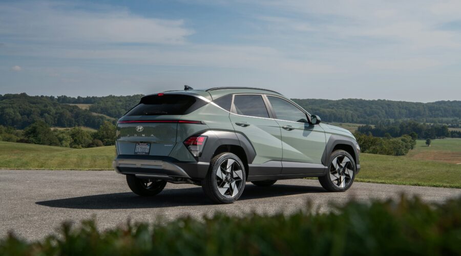 a large Hyuandai car parked facing forward in front of rolling hills; Making The Switch to a Bigger Car Model