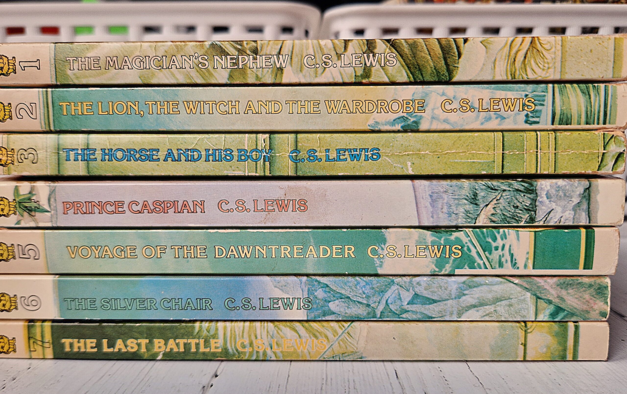 A pile of books viewed horizontally - 7 books of The Chronicles Of Narnia